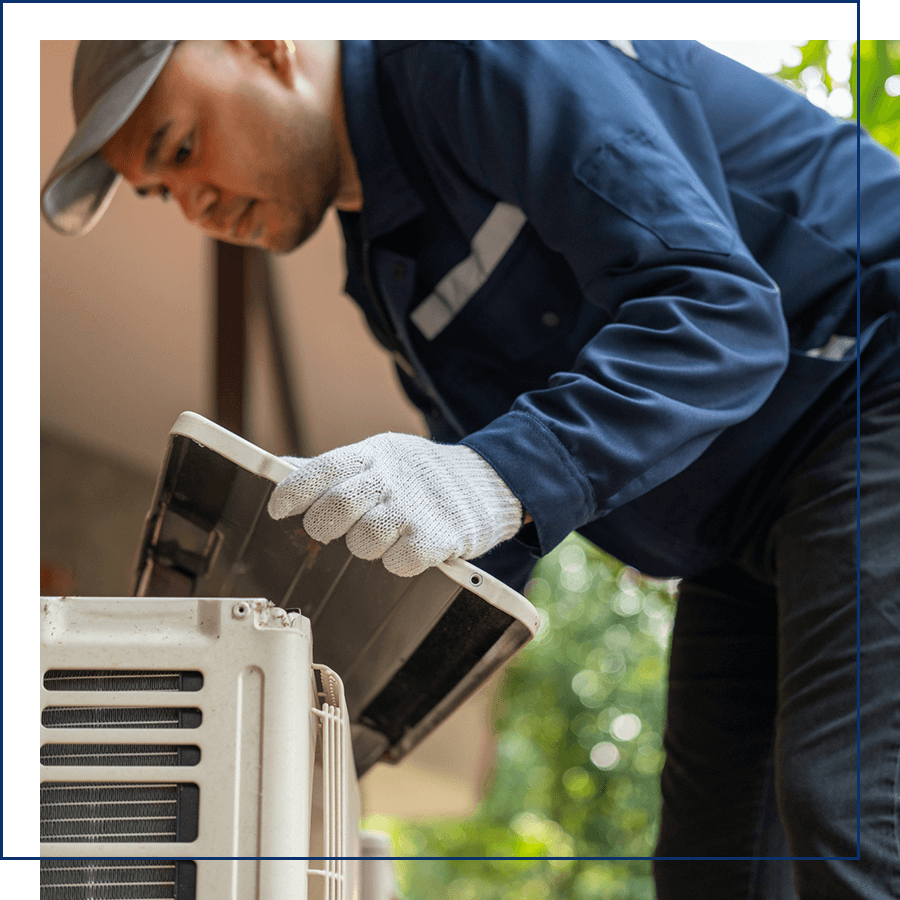 Man fixing an AC unit 