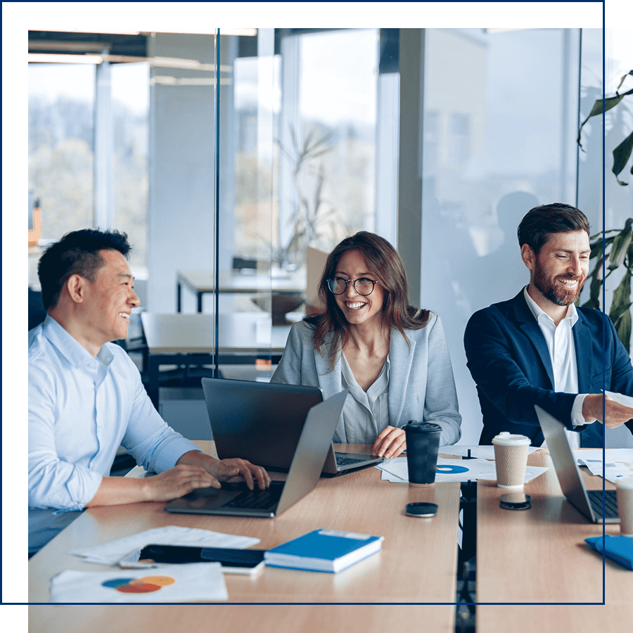 Group of people sitting around a meeting table 
